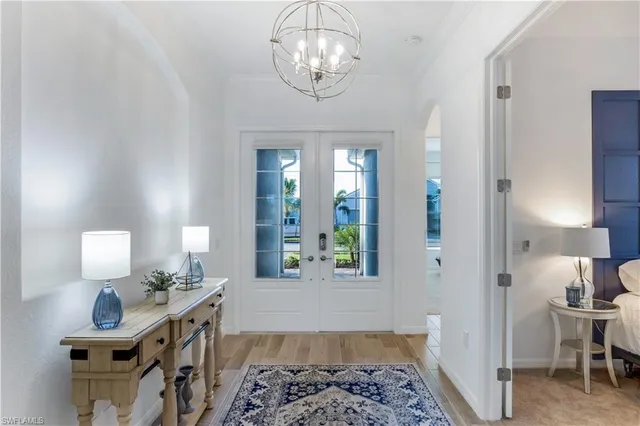 a view of hall way with furniture