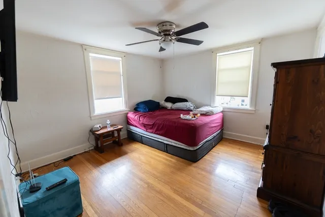 a bedroom with furniture and a window