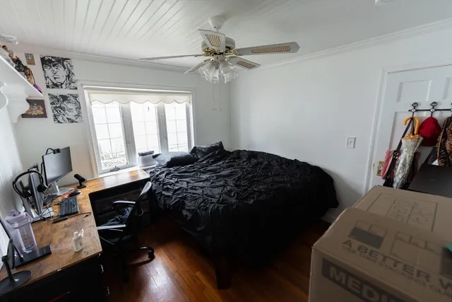 a living room with furniture a rug and a flat screen tv