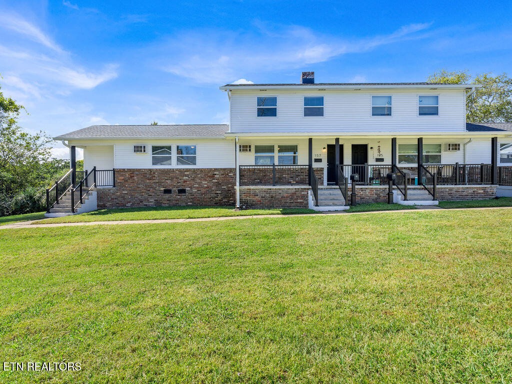 155 Tacoma Road Oak Ridge, TN 37830 - Photo 1 of 33 a front view of a house with a yard