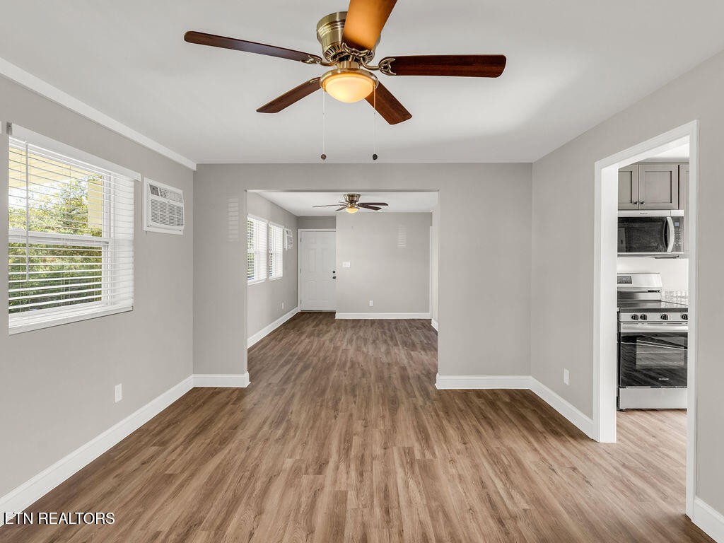 155 Tacoma Road Oak Ridge, TN 37830 - Photo 11 of 33 wooden floor in an empty room with a window