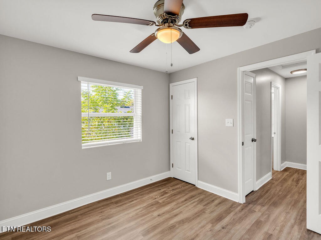 155 Tacoma Road Oak Ridge, TN 37830 - Photo 24 of 33 a view of an empty room with window and wooden floor
