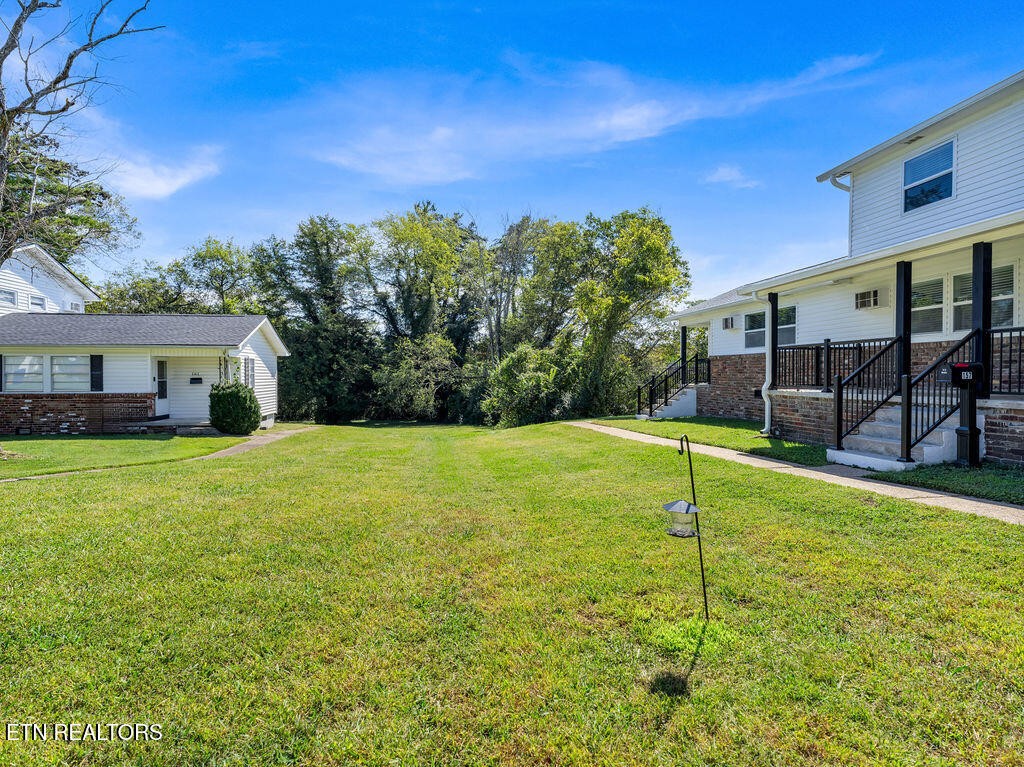 155 Tacoma Road Oak Ridge, TN 37830 - Photo 3 of 33 a view of a house with backyard and porch