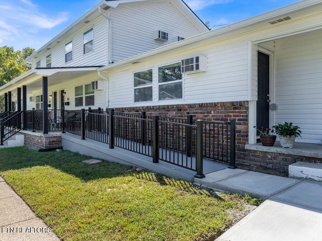 155 Tacoma Road Oak Ridge, TN 37830 - Photo 4 of 33 a view of a white building with swimming pool in front of it