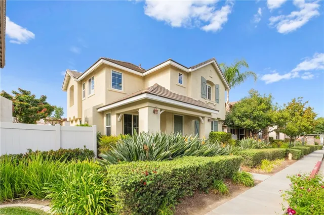 a view of a house with a yard and plants