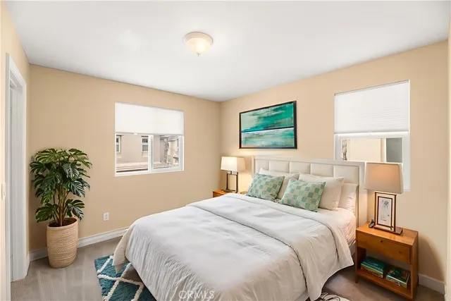 a bedroom with a bed and chair