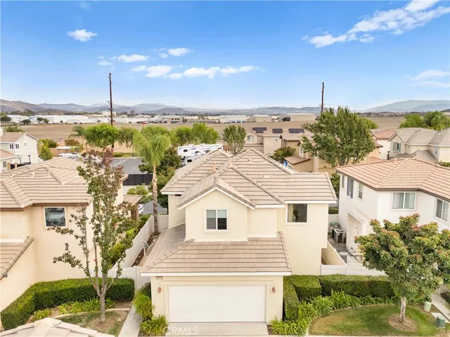 a view of residential houses with outdoor space and ocean view