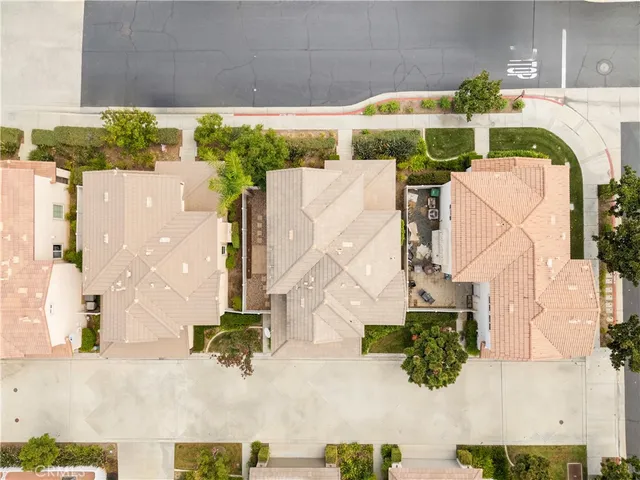an aerial view of residential building with outdoor space and seating