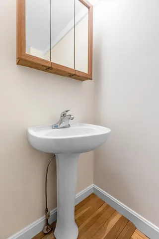 a view of a livingroom with furniture and a table chairs