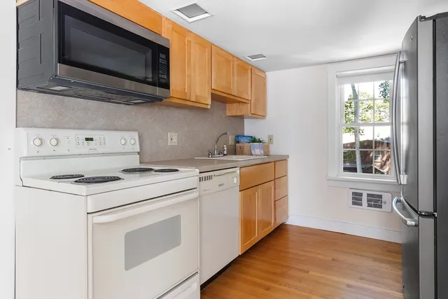 a bedroom with a bed and a cabinets
