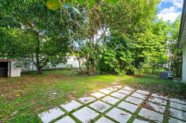 a backyard of a house with lots of green space
