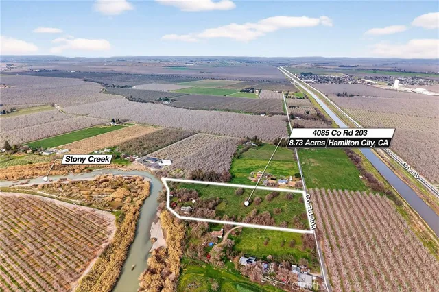 a view of a yard with an ocean view