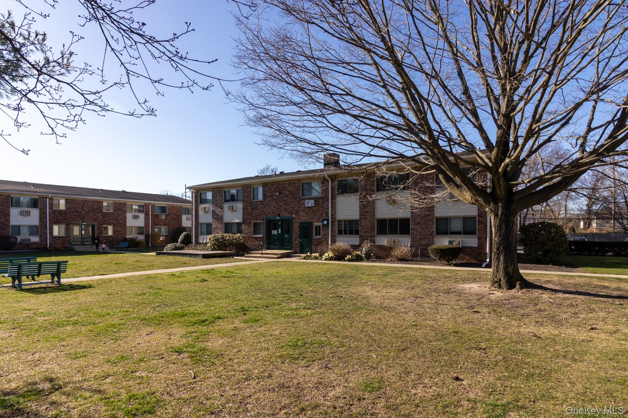 2449 Union Boulevard, Unit 36A Islip, NY 11751 - Photo 11 of 15 a view of a building with a yard