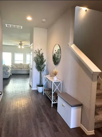 a room with furniture and a wooden floor