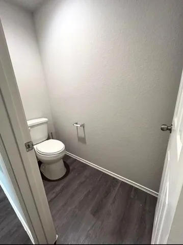 a bathroom with a toilet and a view
