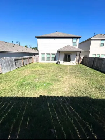 a view of a house with a big yard