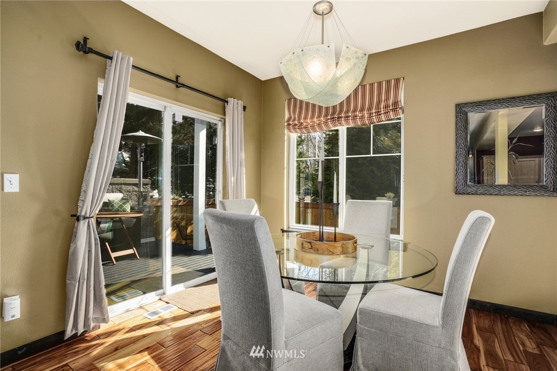 11417 Southeast 171st Street Renton, WA 98055 - Photo 11 of 27 a view of a dining room with furniture wooden floor and livingroom