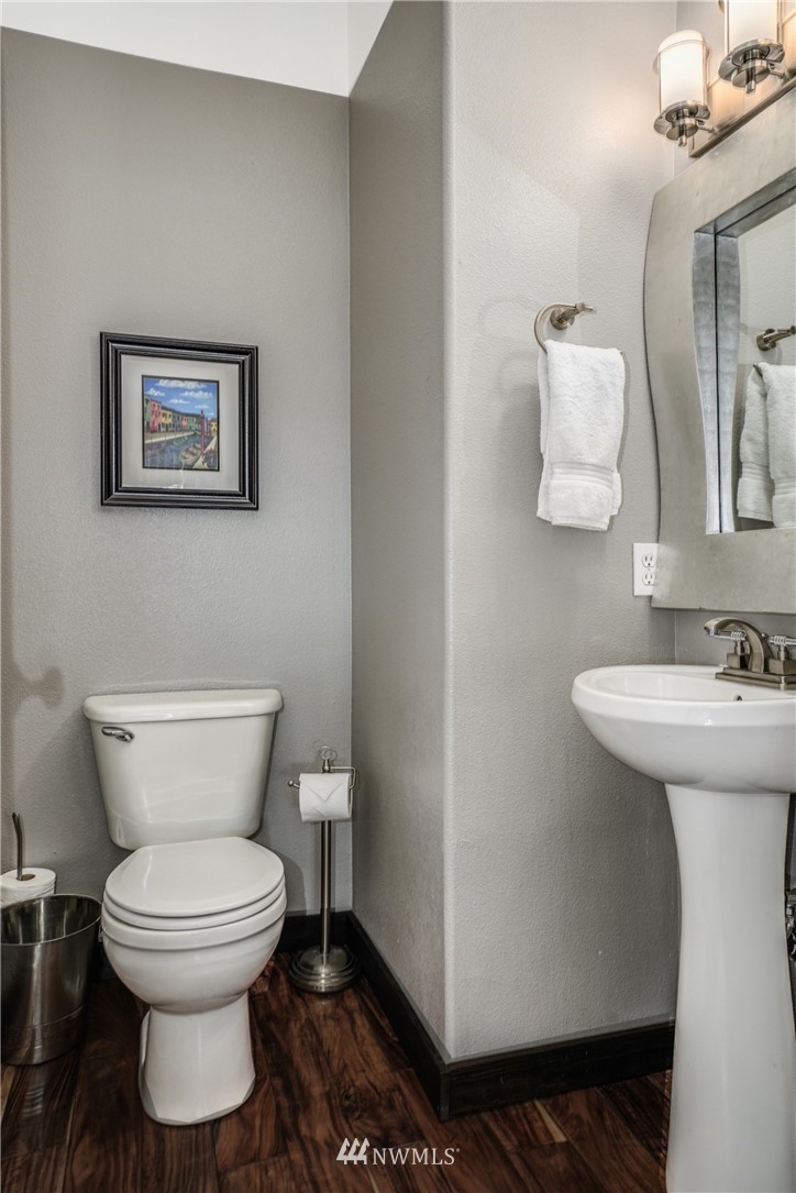 11417 Southeast 171st Street Renton, WA 98055 - Photo 12 of 27 a bathroom with a toilet a sink and mirror