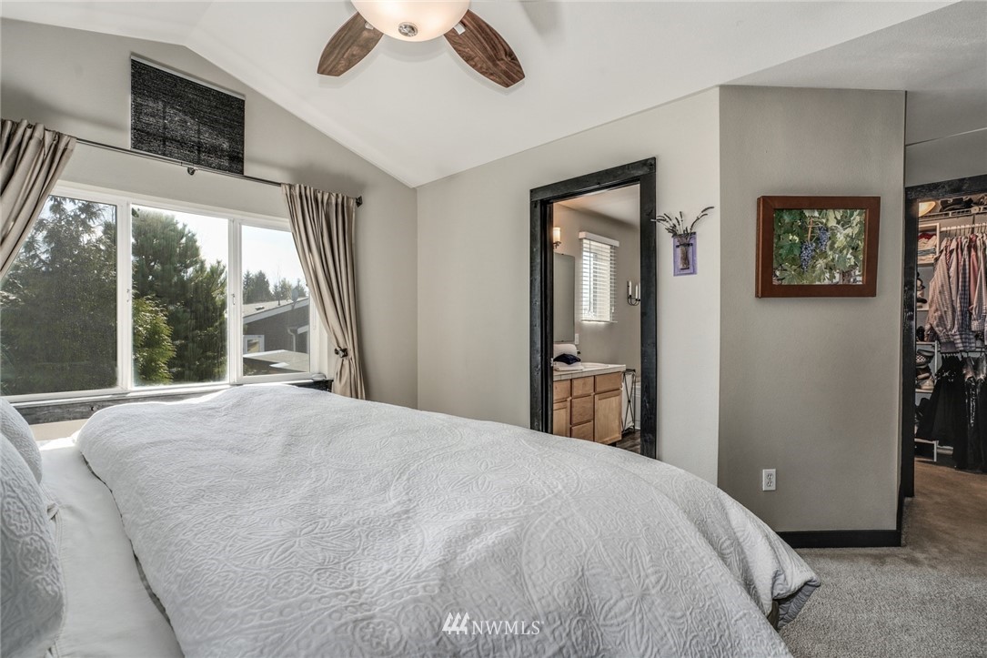 11417 Southeast 171st Street Renton, WA 98055 - Photo 15 of 27 a bedroom with a bed and a large window