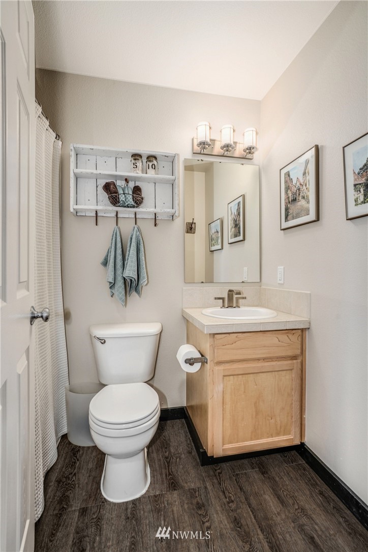 11417 Southeast 171st Street Renton, WA 98055 - Photo 18 of 27 a bathroom with a toilet sink and mirror