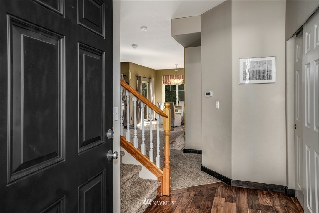 11417 Southeast 171st Street Renton, WA 98055 - Photo 3 of 27 a view of entryway with stairs and a window