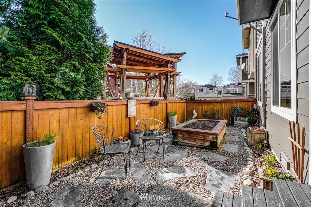 11417 Southeast 171st Street Renton, WA 98055 - Photo 22 of 27 a roof deck with table and chairs