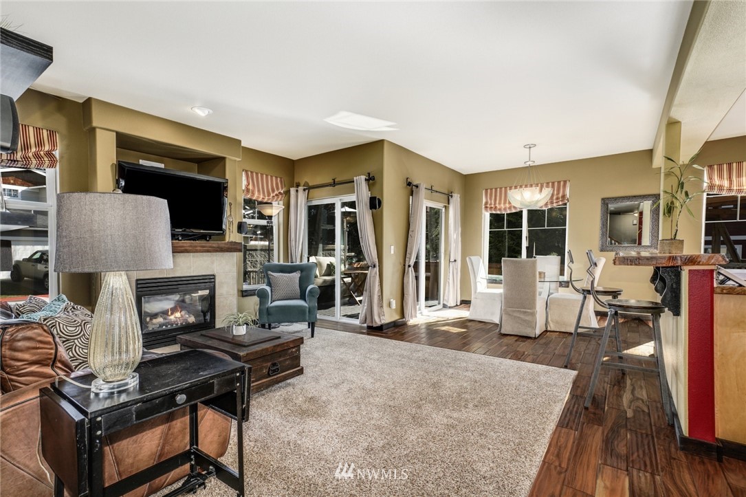 11417 Southeast 171st Street Renton, WA 98055 - Photo 5 of 27 a living room with furniture and a fireplace