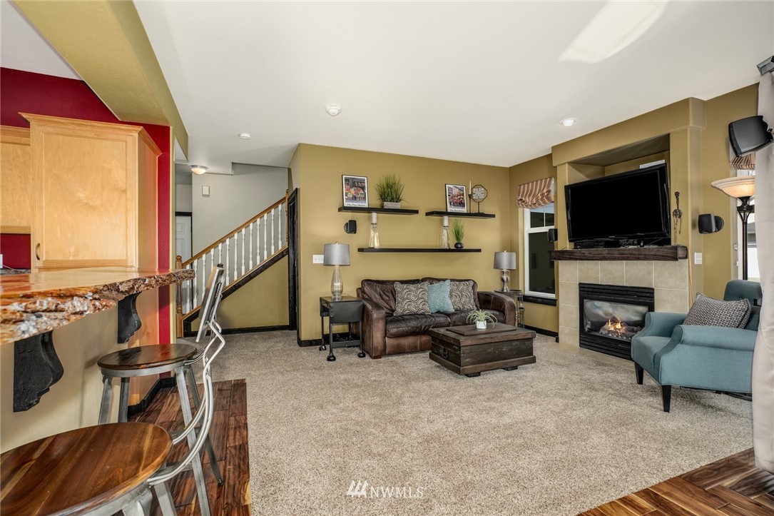 11417 Southeast 171st Street Renton, WA 98055 - Photo 7 of 27 a living room with furniture and a flat screen tv