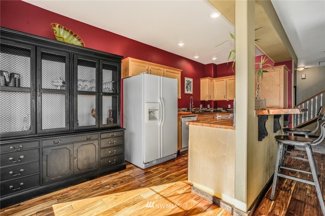 11417 Southeast 171st Street Renton, WA 98055 - Photo 10 of 27 a kitchen with refrigerator and window