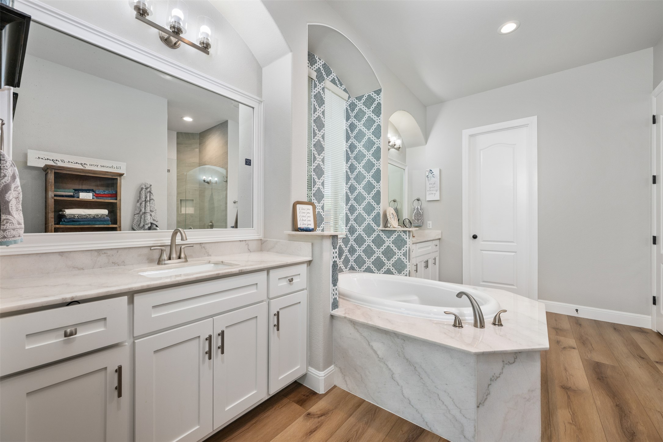 3021 Wedgescale Pass Leander, TX 78641 - Photo 14 of 40 a bathroom with a tub sink and mirror