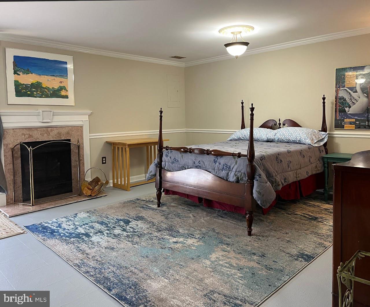 a bed room with a bed and a fireplace