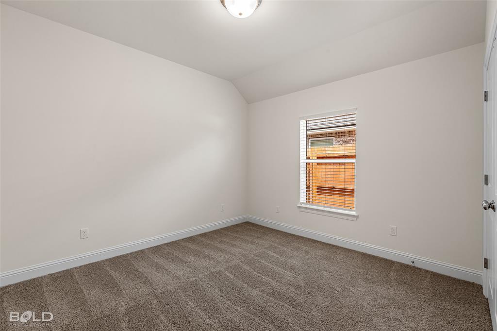 304 Prien Lk Loop Bossier City, LA 71111 - Photo 29 of 39 Interior room featuring neutral wall paint, a window with horizontal blinds, textured carpet, white baseboards, and a semi-flush mount ceiling light fixture