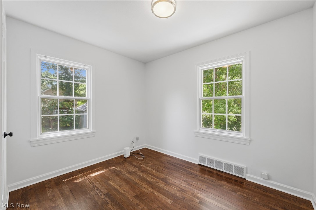 7750 Lewis Road Olmsted Falls, OH 44138 - Photo 20 of 50 Bright interior featuring dark wood-finish flooring, white walls, and two multi-pane windows