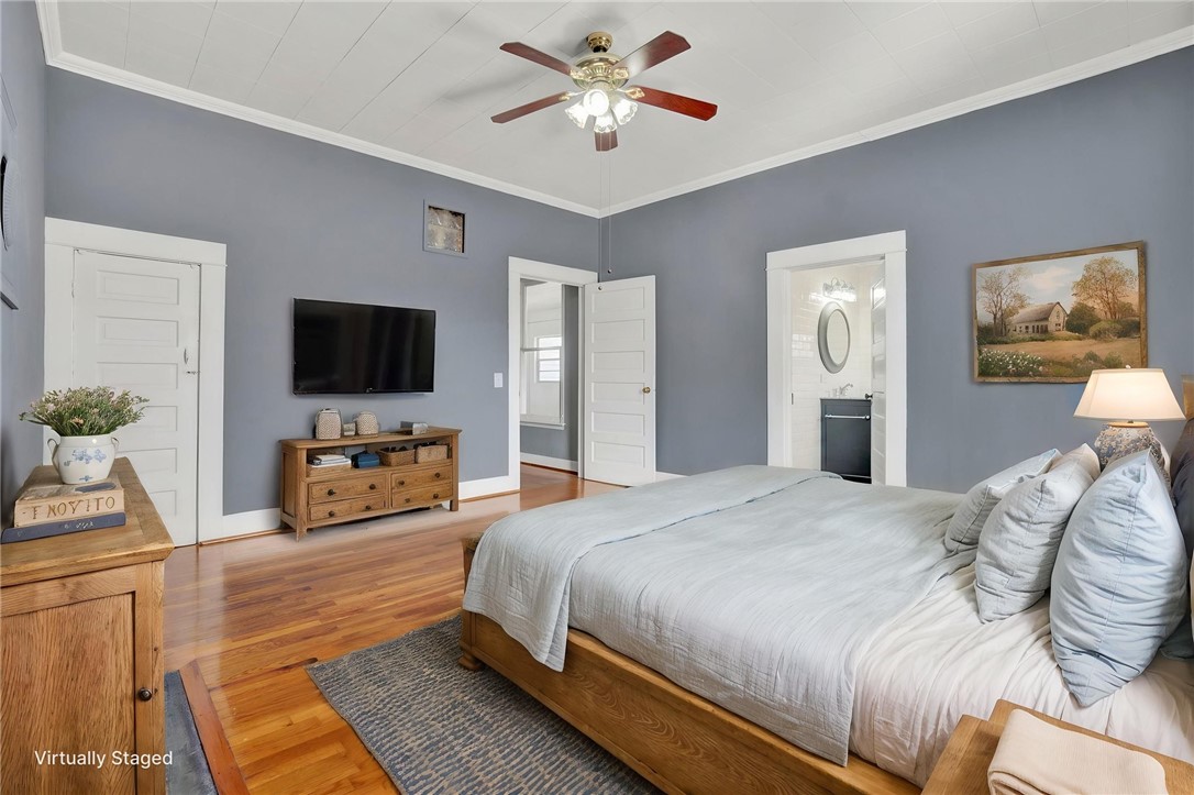 302 Gassaway Street Central, SC 29630 - Photo 11 of 34 VIRTUAL STAGING - This spacious bedroom features hardwood flooring and offers an inviting atmosphere.