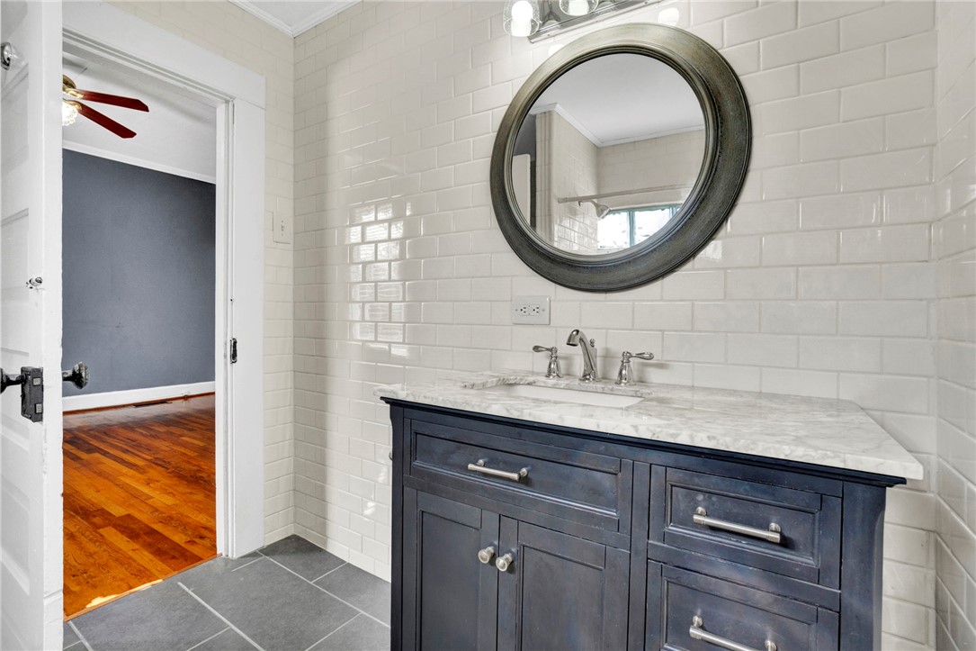302 Gassaway Street Central, SC 29630 - Photo 12 of 34 This sleek bathroom features clean lines and a modern vanity, offering a fresh aesthetic.