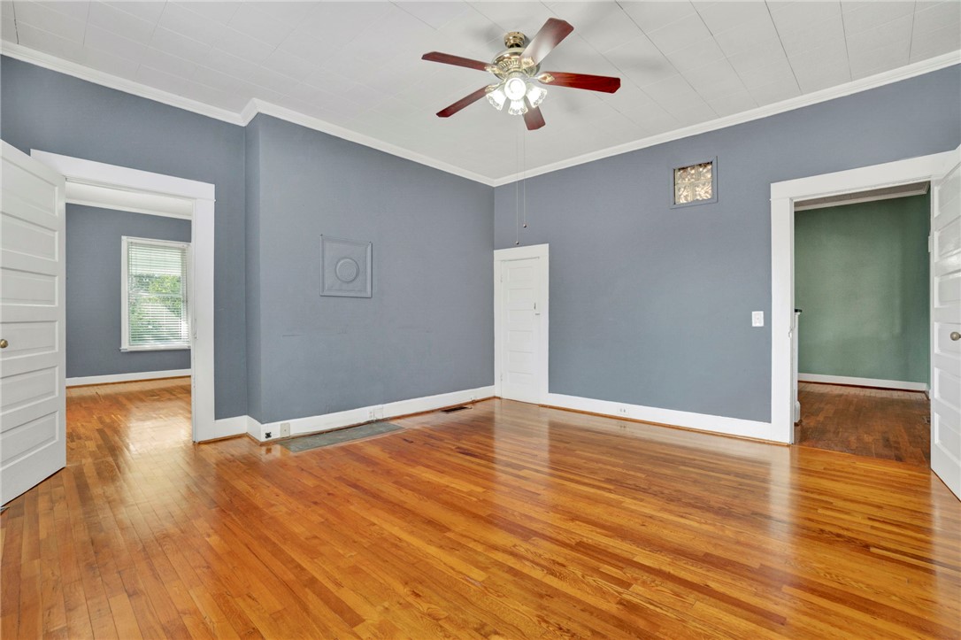302 Gassaway Street Central, SC 29630 - Photo 14 of 34 This versatile room features warm hardwood flooring, ready for your personal touch and style.
