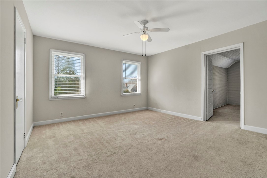 302 Gassaway Street Central, SC 29630 - Photo 17 of 34 This spacious loft area offers ample natural light and a comfortable atmosphere for relaxation.