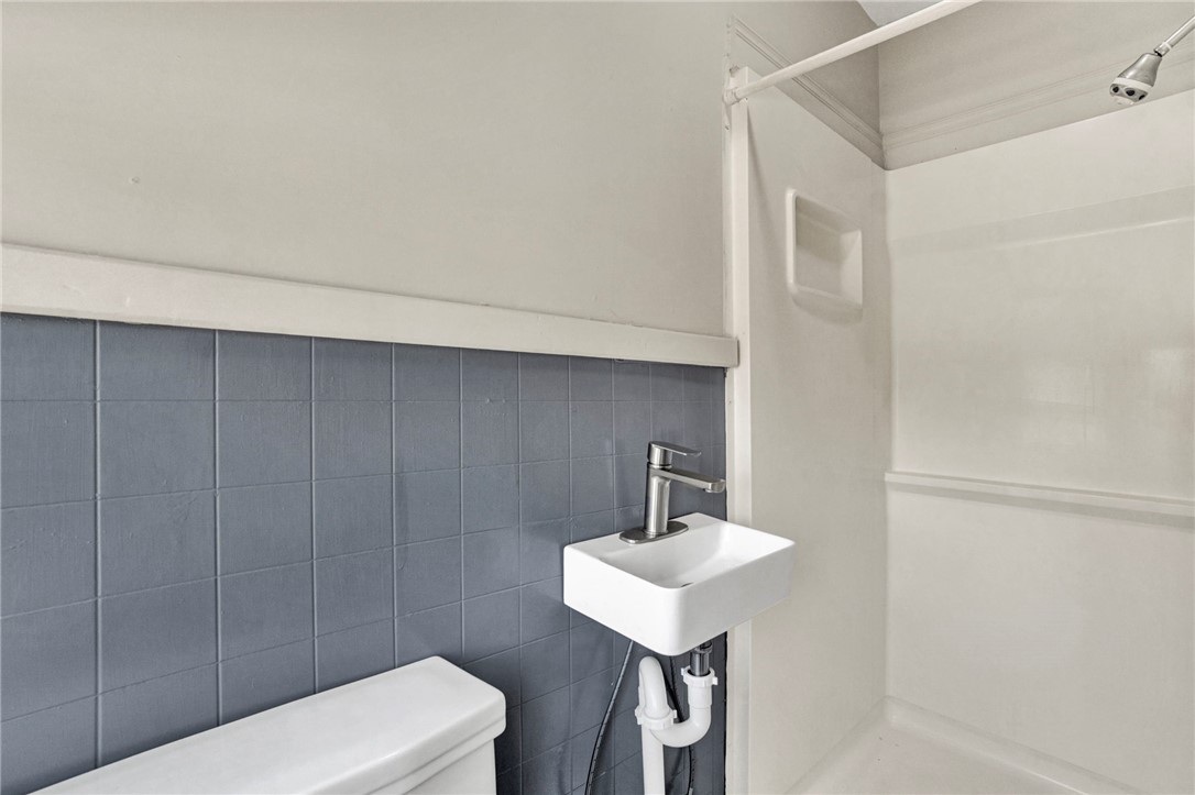 302 Gassaway Street Central, SC 29630 - Photo 22 of 34 This sleek bathroom features contemporary fixtures, maximizing space with essential amenities.