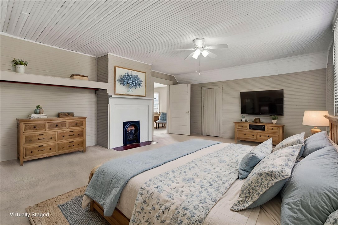 302 Gassaway Street Central, SC 29630 - Photo 23 of 34 VIRTUAL STAGING -This spacious bedroom offers a tranquil retreat with a classic fireplace and inviting ambiance.