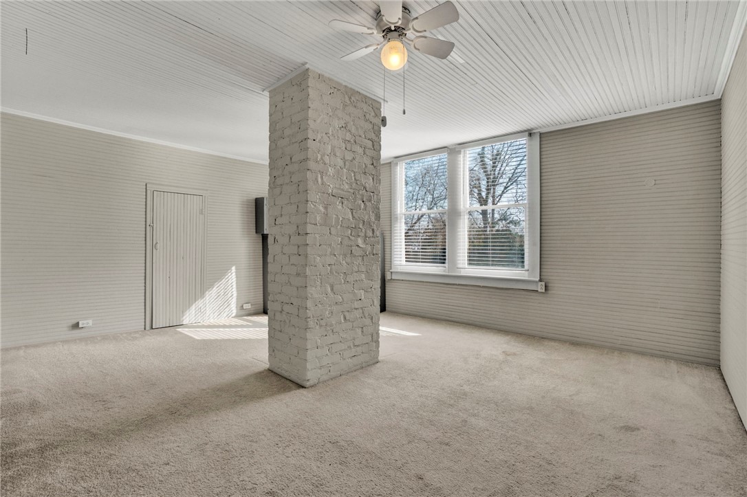 302 Gassaway Street Central, SC 29630 - Photo 25 of 34 Bright and airy bedroom with original brick chimney and ample natural light.