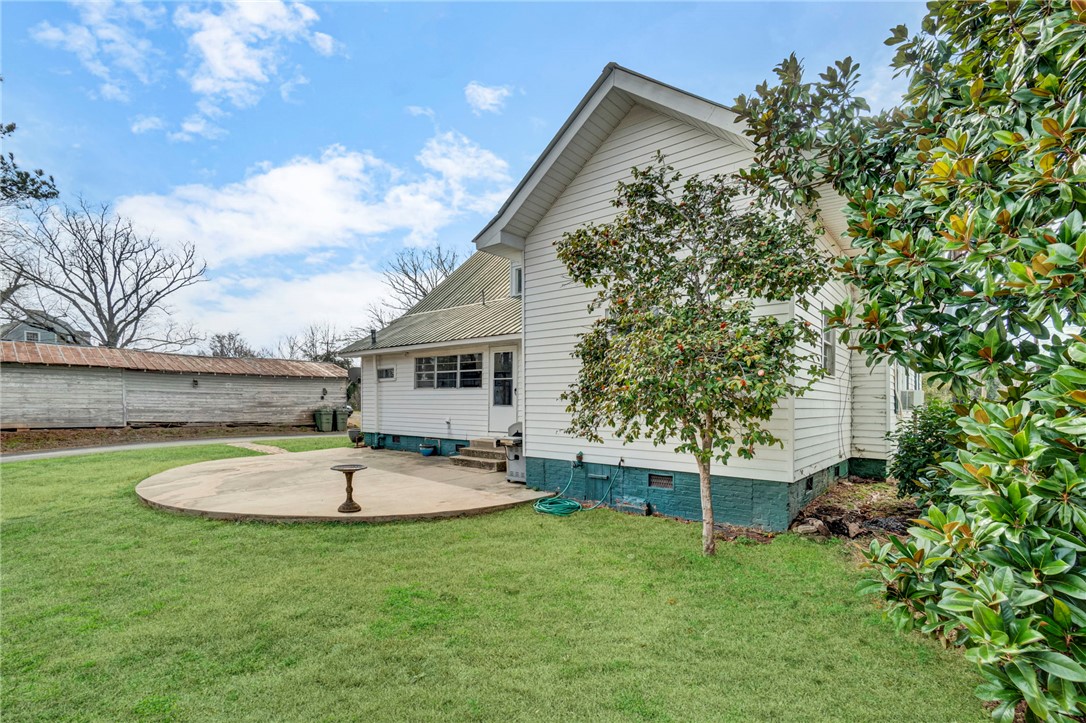 302 Gassaway Street Central, SC 29630 - Photo 30 of 34 This residence offers a tranquil outdoor retreat with a spacious yard and concrete patio.