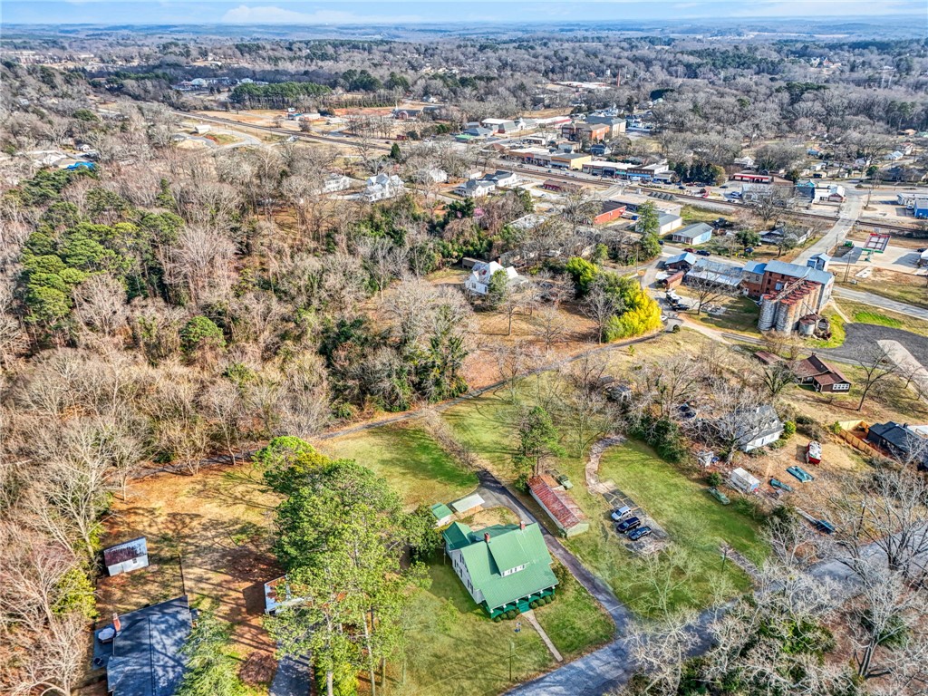 302 Gassaway Street Central, SC 29630 - Photo 34 of 34 An expansive aerial view reveals a charming rural landscape with lush greenery and scattered homes.