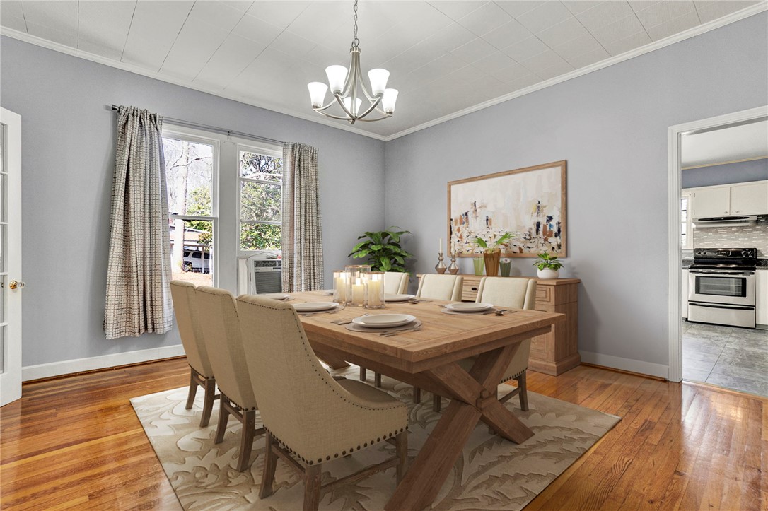 302 Gassaway Street Central, SC 29630 - Photo 5 of 34 VIRTUAL STAGING -This dining room offers a warm and inviting atmosphere for meals and gatherings.
