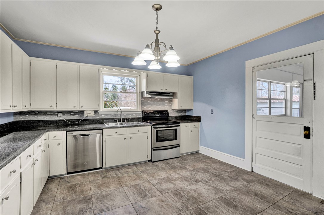 302 Gassaway Street Central, SC 29630 - Photo 8 of 34 This spacious kitchen offers ample cabinet storage and modern appliances for everyday convenience.