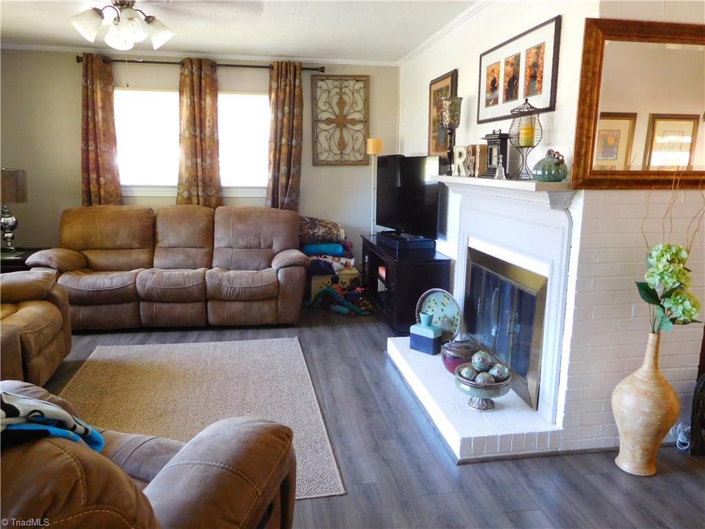 512 Spruce Street High Point, NC 27262 - Photo 3 of 19 Updated flooring throughout entire house. Enjoy relaxation with friends/family in this spacious living room
