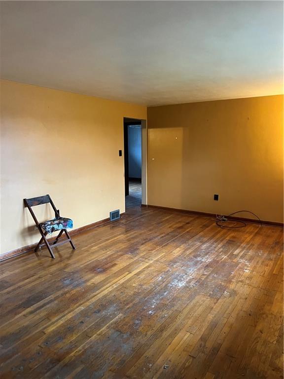 2037 McKees Rocks Road McKees Rocks, PA 15136 - Photo 2 of 19 a view of a room with wooden floor and a bench
