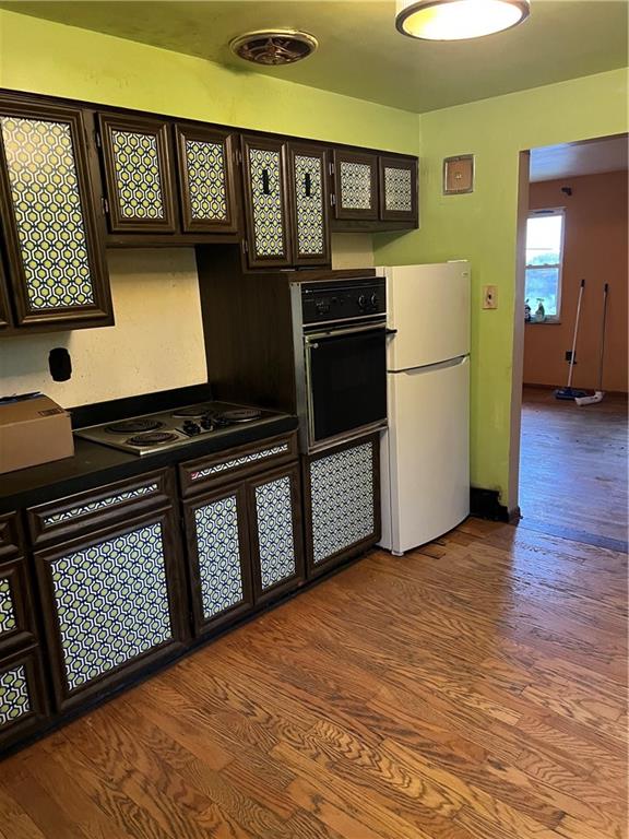 2037 McKees Rocks Road McKees Rocks, PA 15136 - Photo 4 of 19 a kitchen with stainless steel appliances a refrigerator and a stove top oven