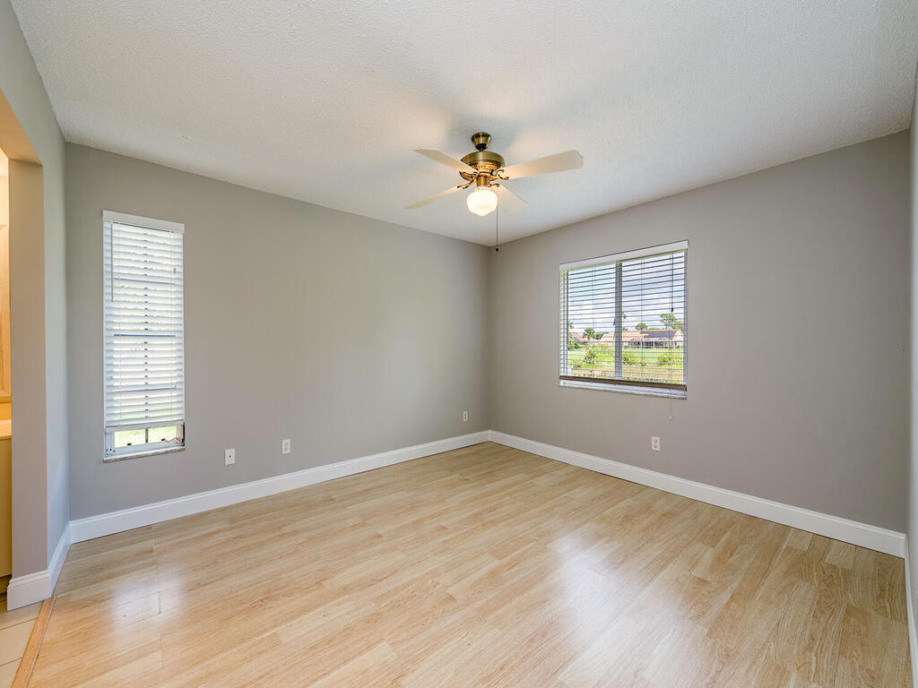 740 Augusta Boulevard, Unit E101 Naples, FL 34113 - Photo 7 of 12 a view of an empty room with a window