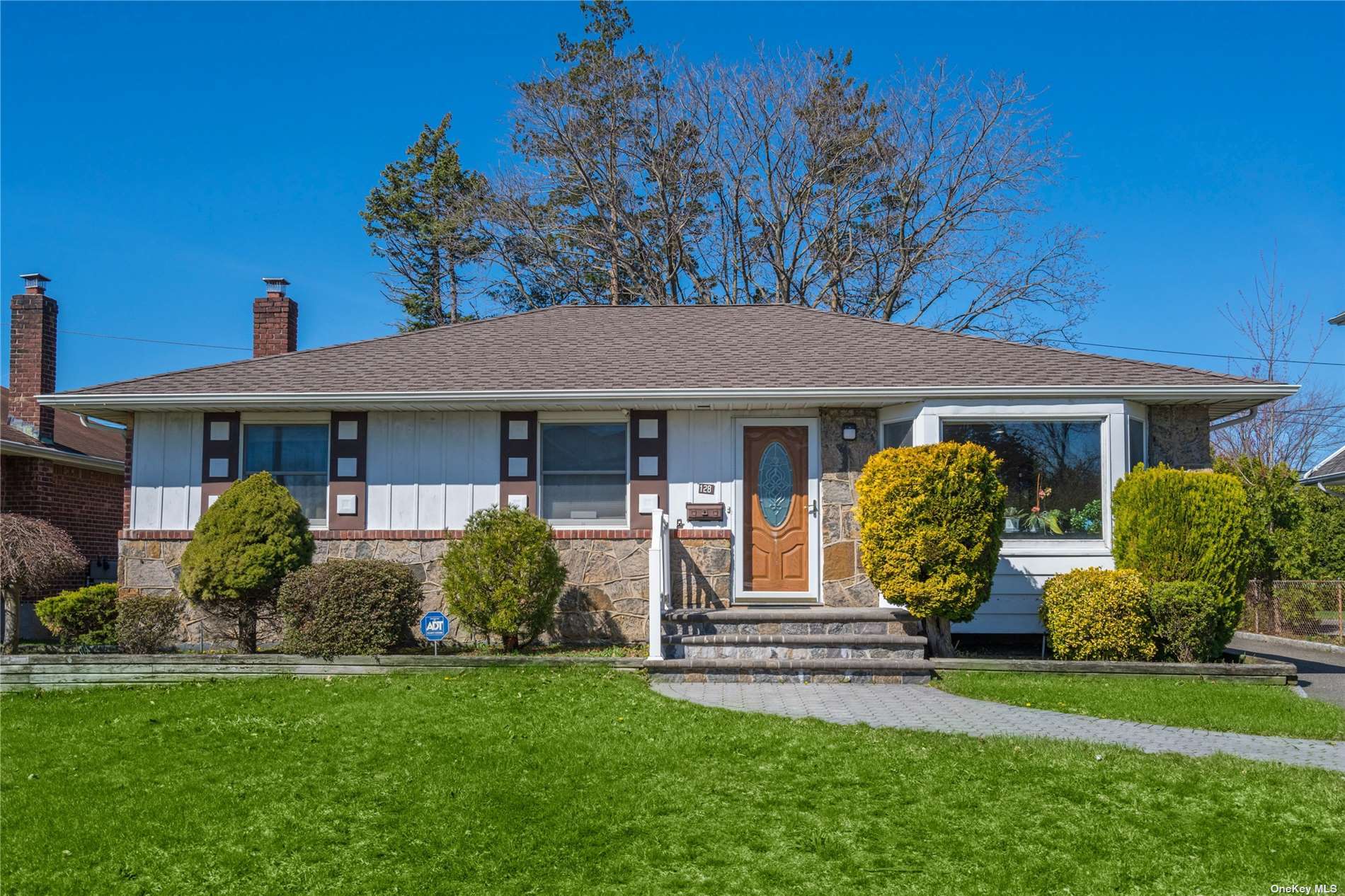 128 Ketchams Road Syosset, NY 11791 - Photo 1 of 1 a front view of a house with garden