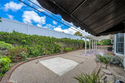 a view of a backyard with pathway
